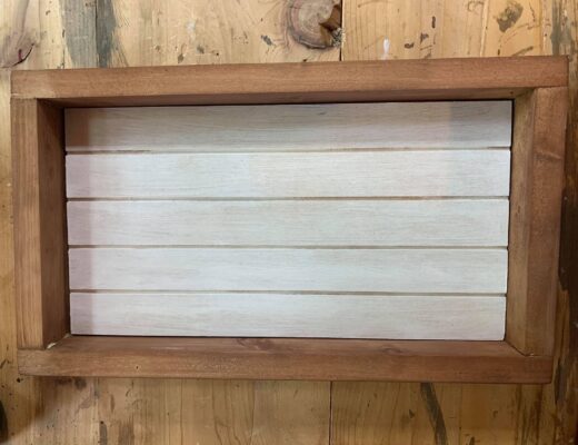 whote shiplap sign with brown frame
