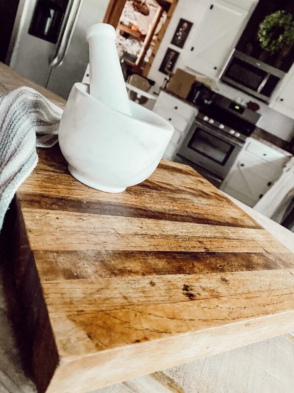 wood cutting board with marble mortar and pestal