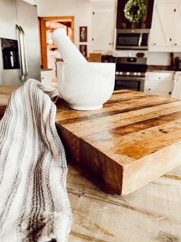 wood cutting board with marble mortar and pestal