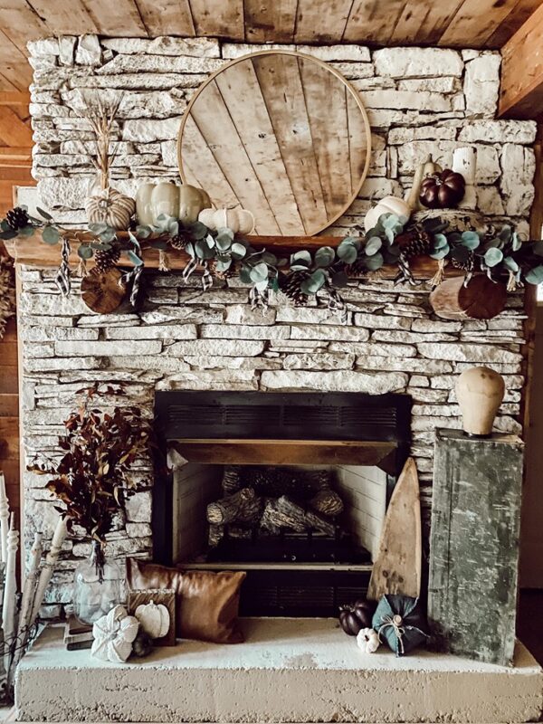 rustic mantle with stone and pumpkin